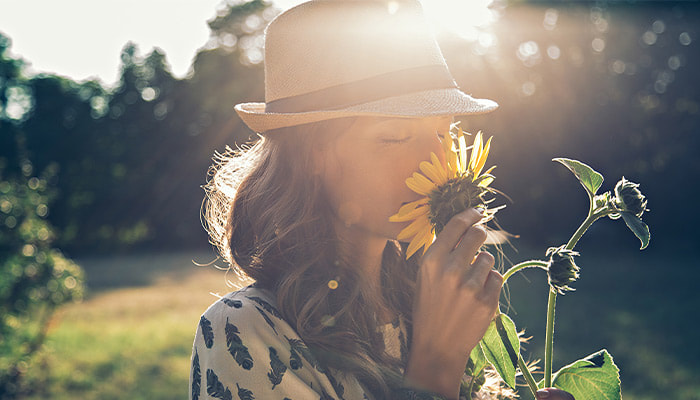 Woman with scleroderma and sunflower